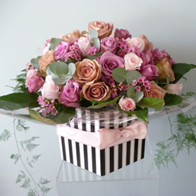Extra large vintage hatbox of 40 roses and wax flowers with foliage.