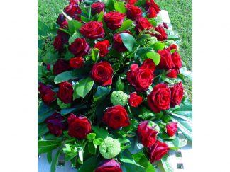Traditional coffin spray- red roses for everlasting love