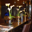 Calla lilies in mirrored vases