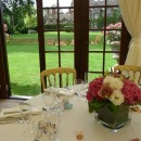 Cubed vases of pink hydrangea, white double lisianthus and vintage ‘Amnesia’ roses