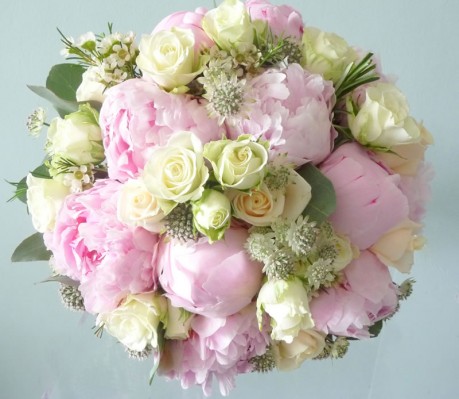 Hand tied wedding bouquet of peonies, astrantia and wax flowers.
