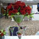 Giant martini vase of red roses.