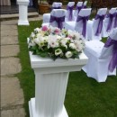 3 foot tall white plinths flank the wedding ceremony aisle at Deans Place.