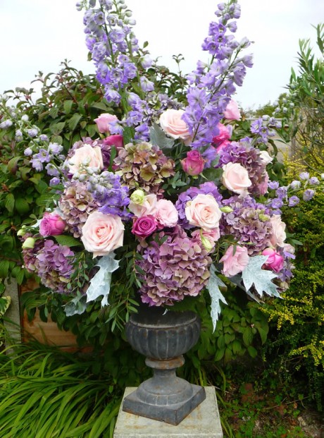 Urns filled with vintage style flowers